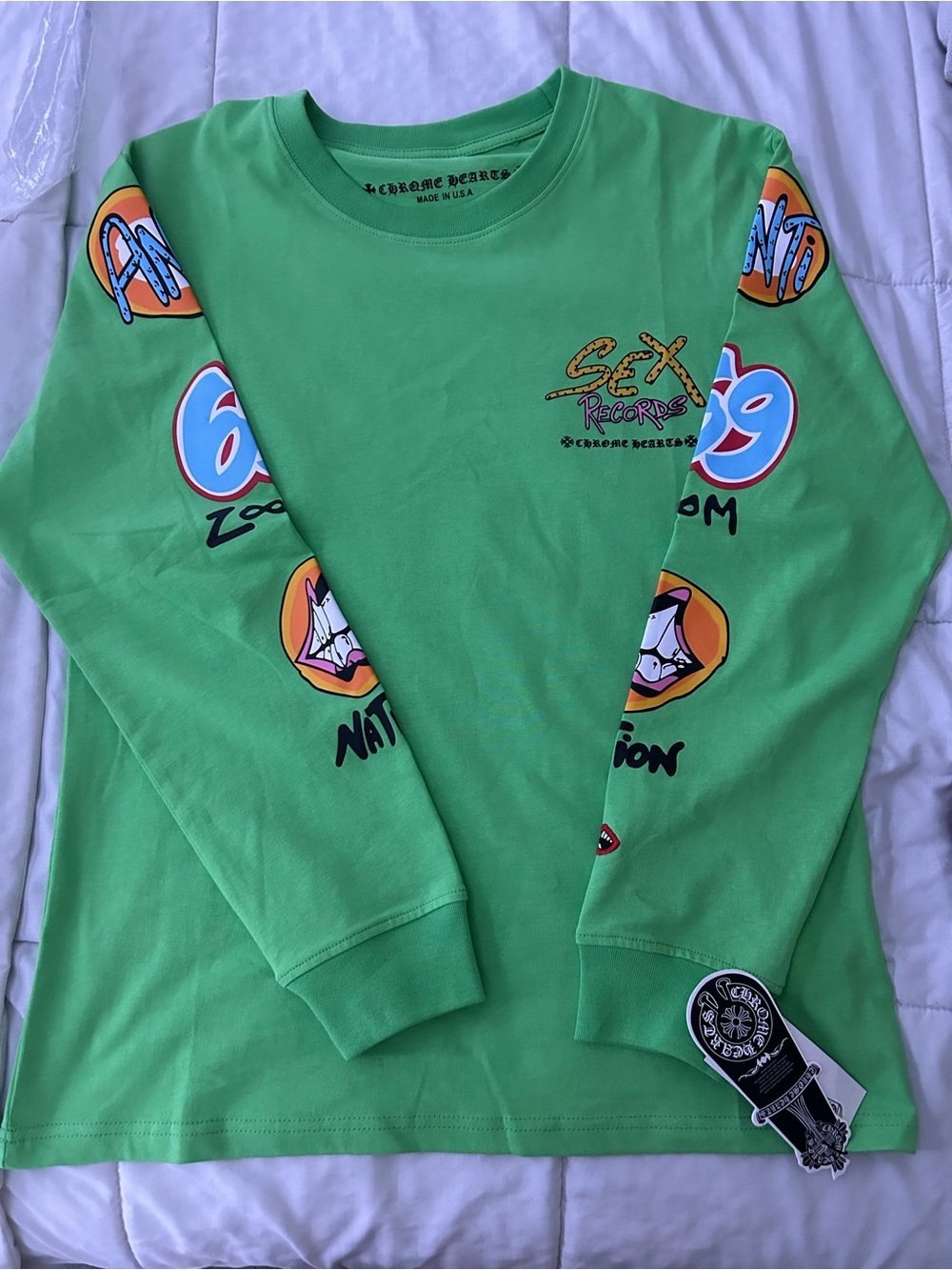 Green Long-Sleeve Graphic Tee with Multicolor Sleeve Prints